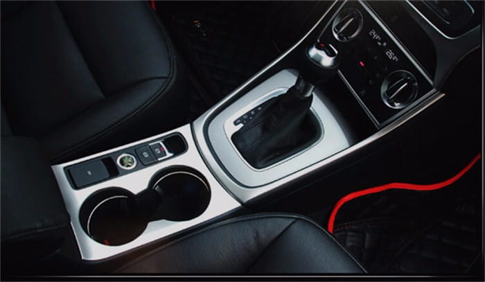 Silver-trimmed center console with dual cup holders and gear shift area in the Audi Q3 2012-2016 interior trim decoration set.