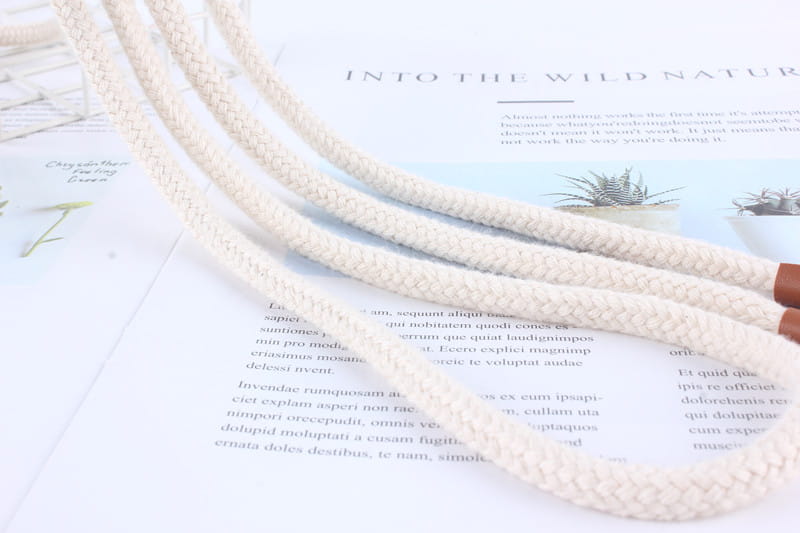 Cream-colored braided rope belt for women featuring a textured woven pattern and wooden-handled ends, designed as a tassel waistband dress accessory.