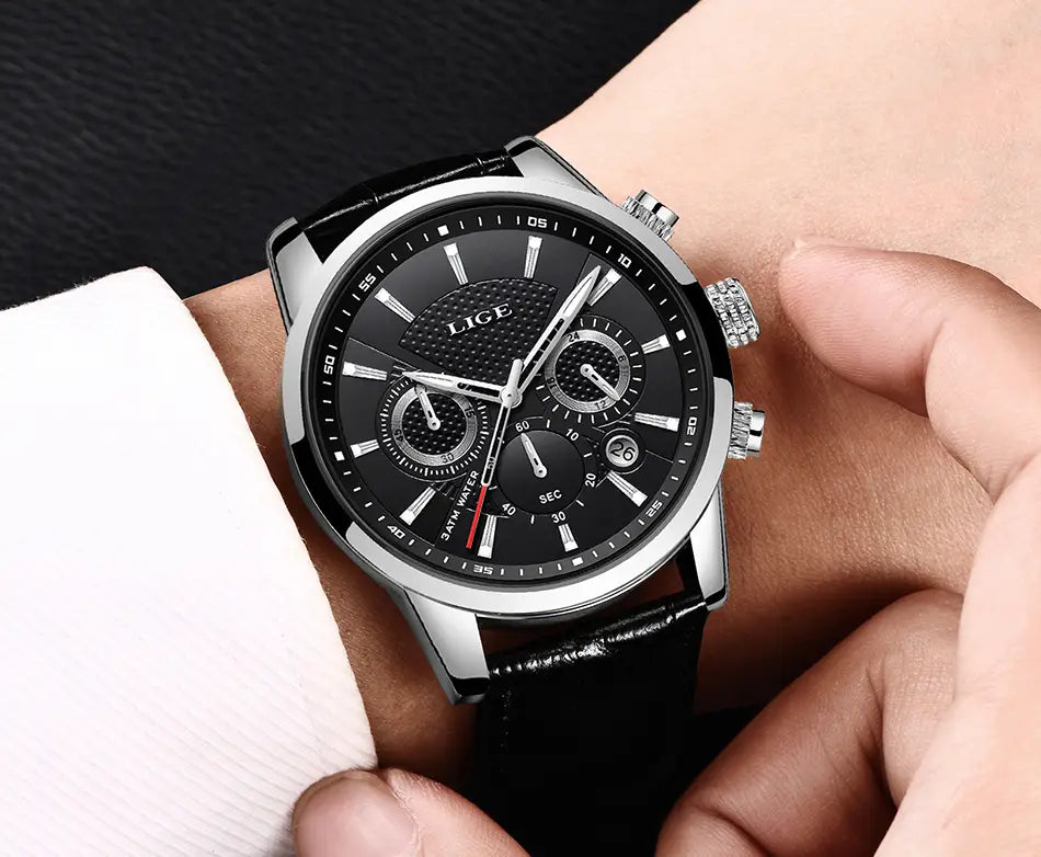 Lige men’s leather chronograph quartz watch with black leather strap silver case black dial three subdials red second hand and lige branding.