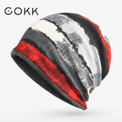 Cokk brand floral knit beanie hat unisex casual autumn headwear with bold red black and white horizontal stripes featuring a textured knit pattern.