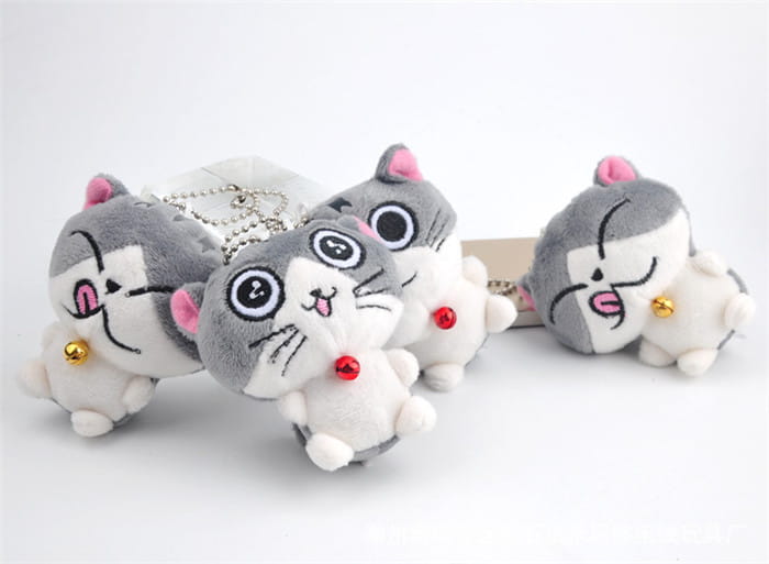 Adorable gray and white plush cat keychains with pink ears red bell accents and embroidered facial features used as cute gray kitten bag charm toys.