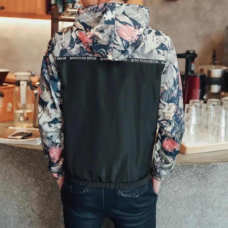 mens hooded jacket asia size featuring a black lightweight windbreaker with pink white and navy blue floral patterns on the sleeves and hood