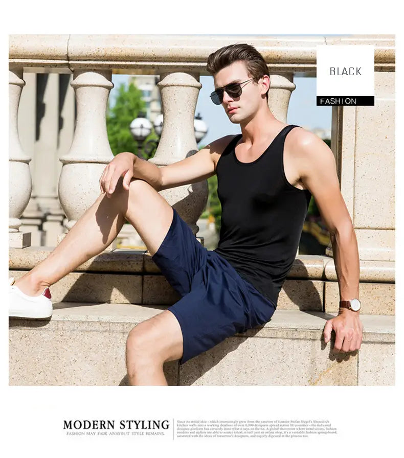 Black sleeveless tank top made from a silk blend with a fitted modern cut designed for casual wear.