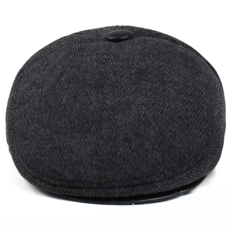 Gorra plana tipo herringbone para hombre de invierno con cubreorejas en lana gris oscura con patrón herringbone y botón negro en la parte superior