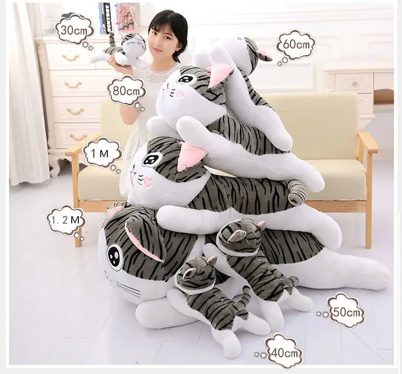 a collection of cheese cat soft animal plush toys featuring gray and white striped soft animal dolls with pink inner ears in various sizes