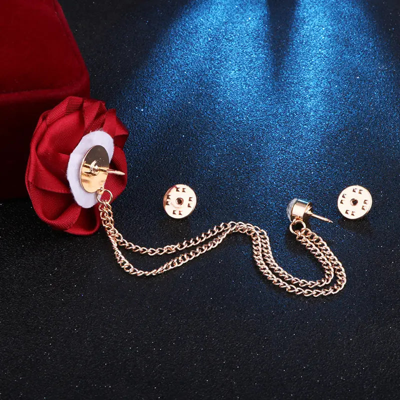 Gold-toned chain-link tie pin with red fabric rose accent and matching circular backings for men suit brooch tassel chain.