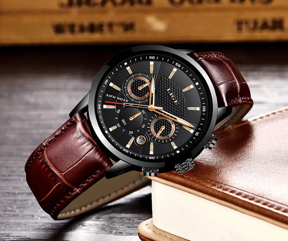Lige men’s leather chronograph quartz watch featuring a black dial with gold-toned accents and a brown crocodile-pattern leather strap.