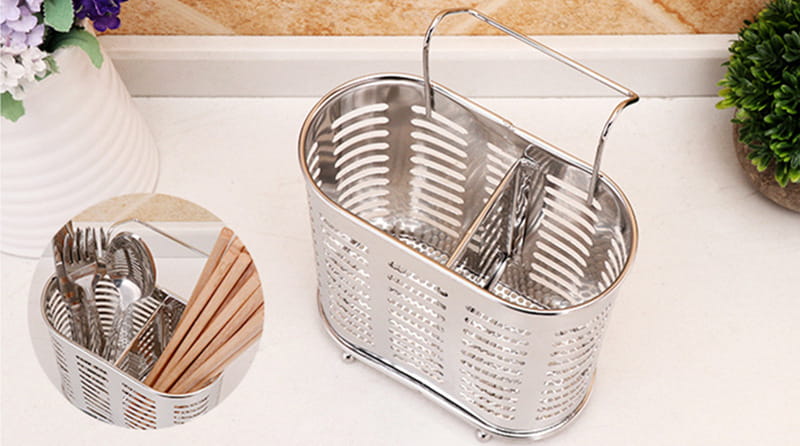 Stainless steel cutlery and utensil storage rack featuring a handle and divided compartments for organized kitchen utensil caddy.