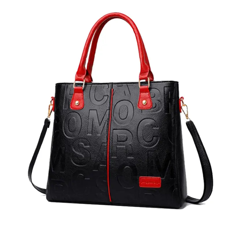 Black crossbody handbag in pu leather with embossed lettering and red handles and shoulder strap in style1 style2.