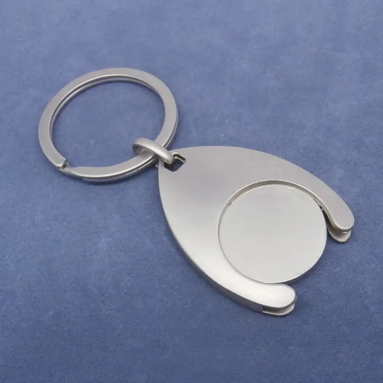 Custom engraved metal keychain in silver metallic with a sleek teardrop-shaped design featuring an integrated coin holder.