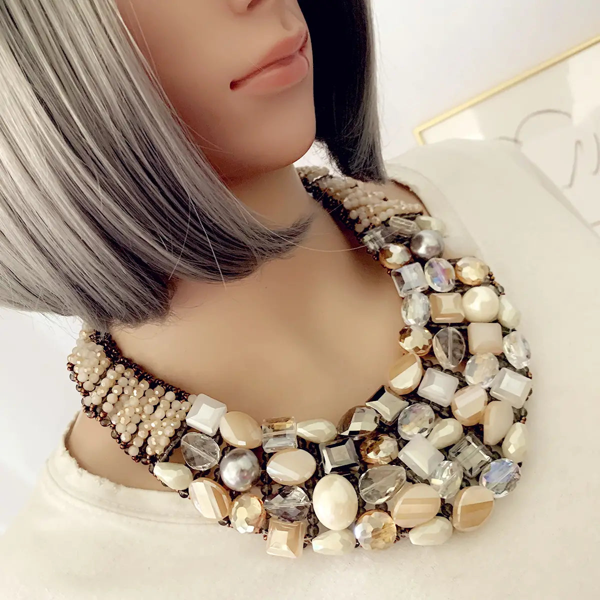 Crystal pearl statement choker necklace featuring a layered design with mixed-cut crystals and pearls in cream, champagne, silver, and gold tones.
