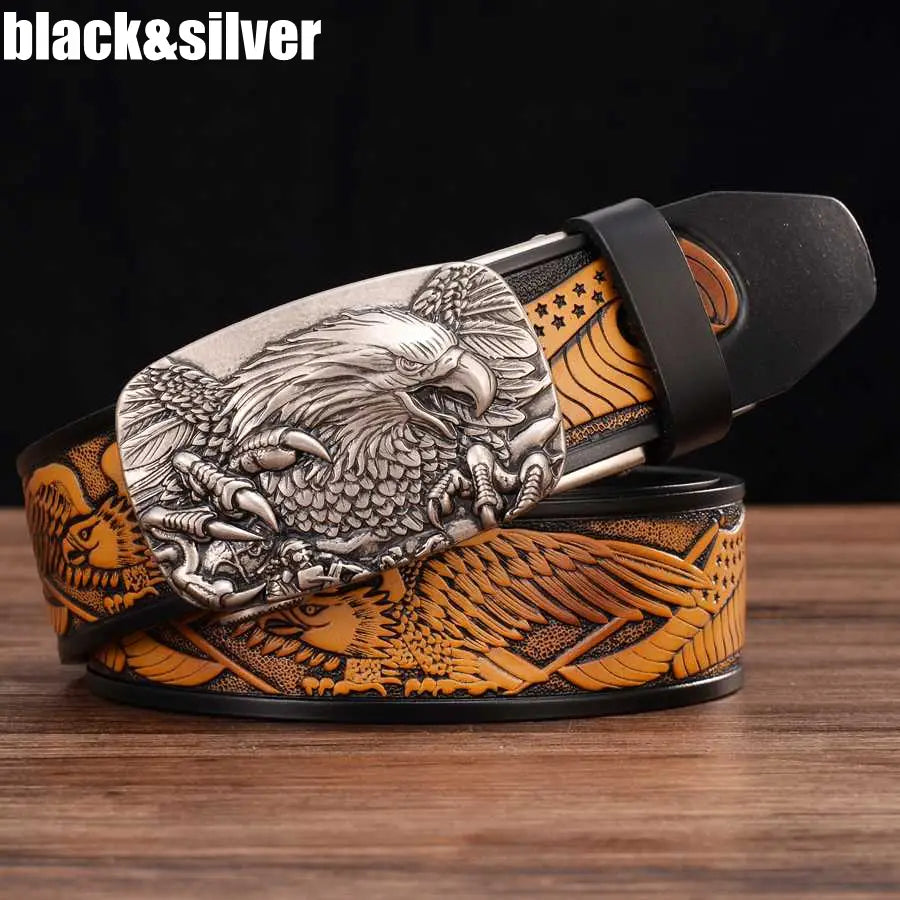 Men’s leather ratchet belt featuring a silver eagle buckle with black and tan leather straps embossed with detailed designs.