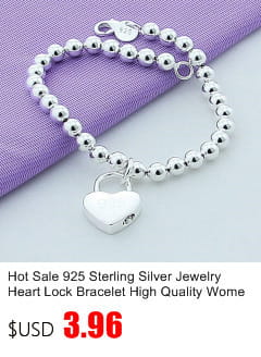 silver heart lock bracelet with round bead links and polished metallic finish complements sterling silver zircon flower hoop earrings.