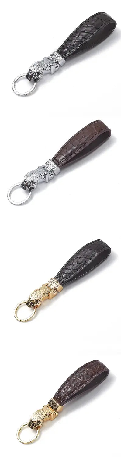 Black crocodile-patterned leather keychain with a silver-toned metal tiger head clasp and gold-tone accents designed as a luxury car key ring.