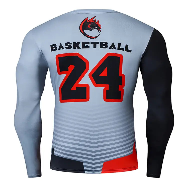 The back side of a gray and black long-sleeved compression basketball shirt with red accents features the number 24 in bold black outlined in red above a dragon print logo.