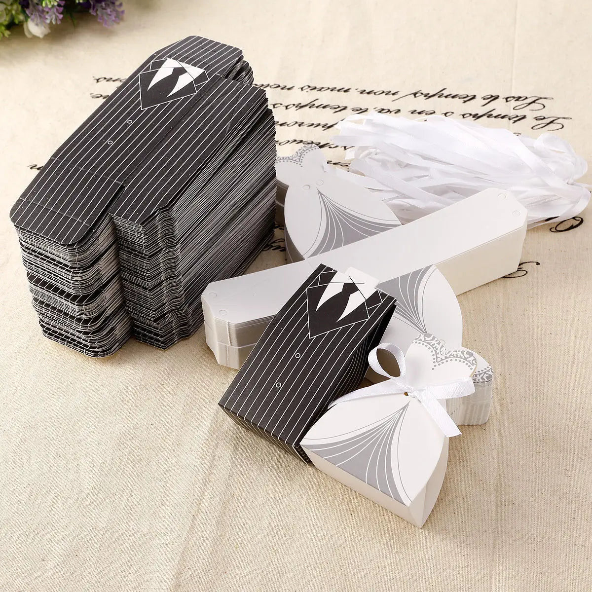 black and white pinstripe paper wedding favor candy boxes designed to resemble tuxedos with bow tie detail for bride and groom events 30 pcs