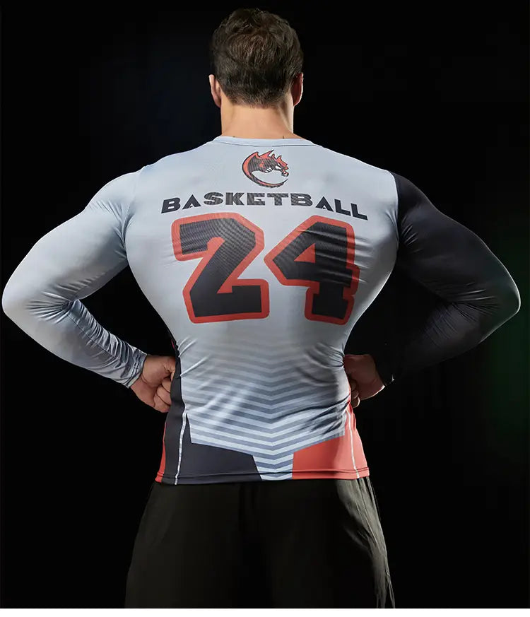 Gray and black compression basketball long sleeve shirt with orange trim and dragon print showing the back side featuring the number 24 and basketball text.