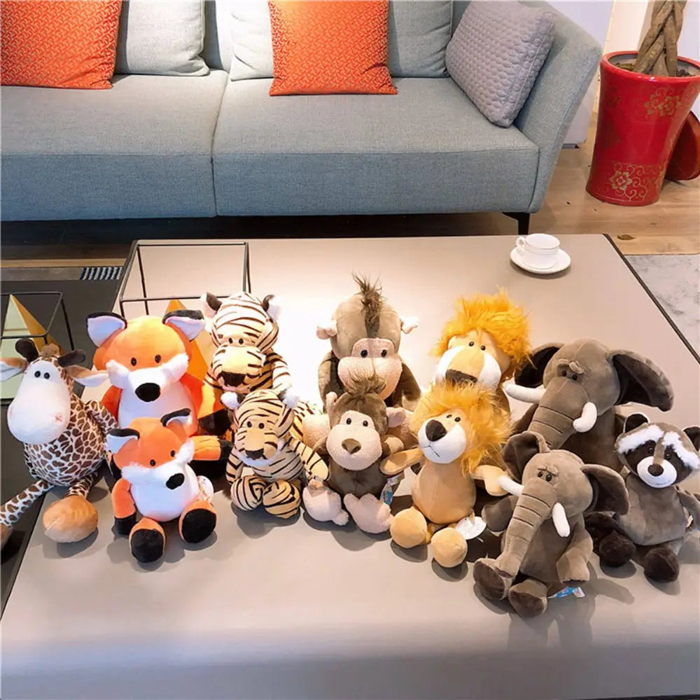 a collection of plush toy safari animal stuffed dolls featuring a giraffe with brown and white spots, an orange fox with black paws, a striped zebra, monkeys, lions with golden manes, gray elephants, and raccoons all made with soft plush filling and measuring 25cm.