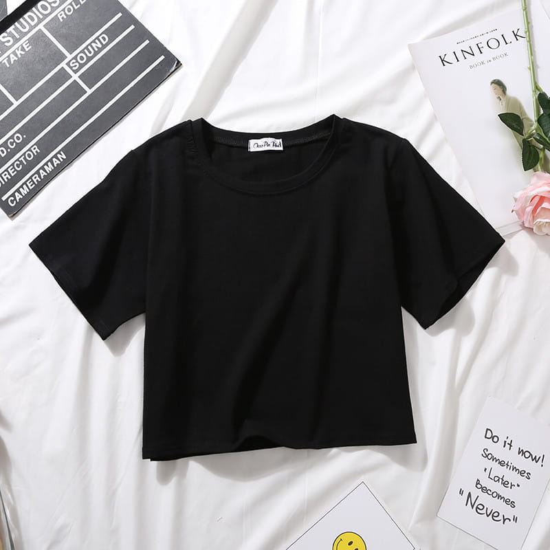 Black solid short-sleeve crop top with a simple round neckline for casual wear.