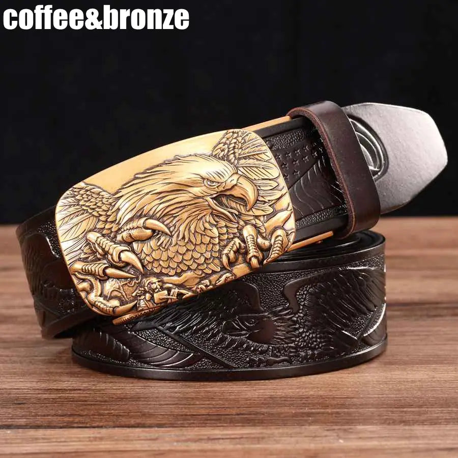 Men’s leather ratchet belt with a golden-brown eagle-engraved buckle and a dark brown leather strap.