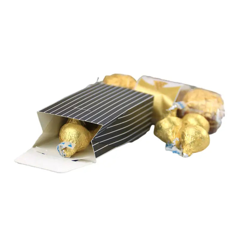 black and white striped paper box filled with gold wrapped chocolates as part of bride and groom wedding favor candy boxes 30 pcs set