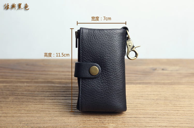 Leather key chain wallet for men featuring black leather with a textured surface, brass-colored snap button closure, and metal clasp.