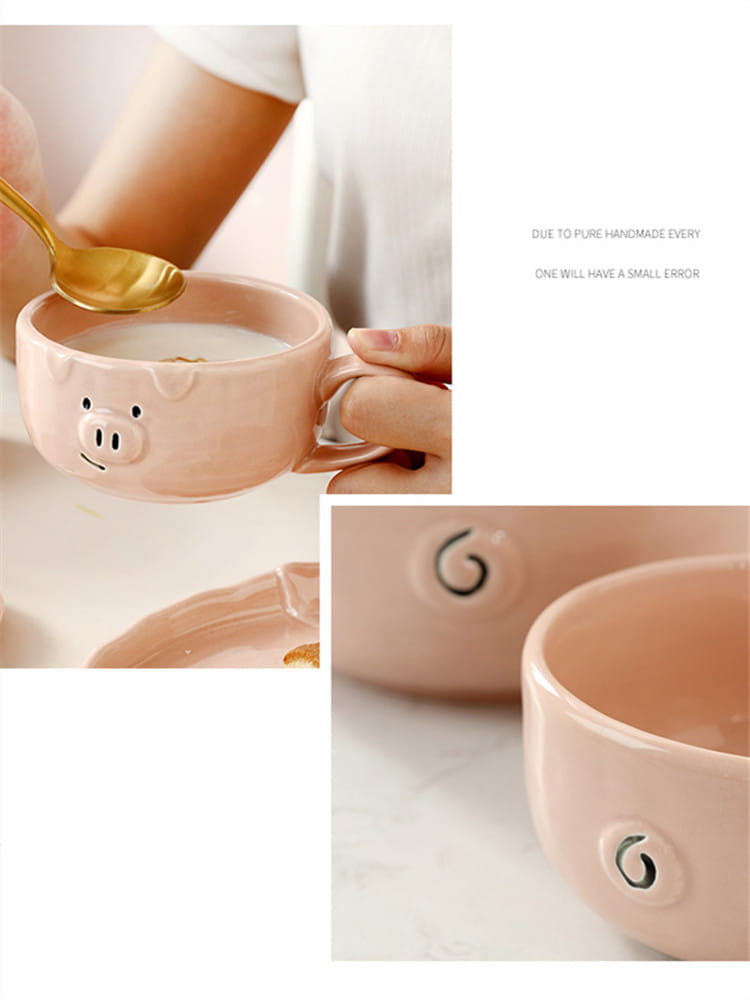 Pastel pink ceramic mug shaped like a pig with black dot eyes and snout featuring a handle from the cute pig ceramic dinnerware set.