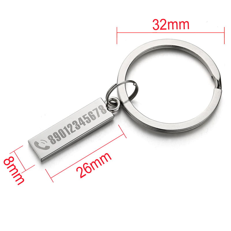 Silver rectangular personalized engraved metal anti-lost keychain with phone number and icon attached to a circular metal ring.