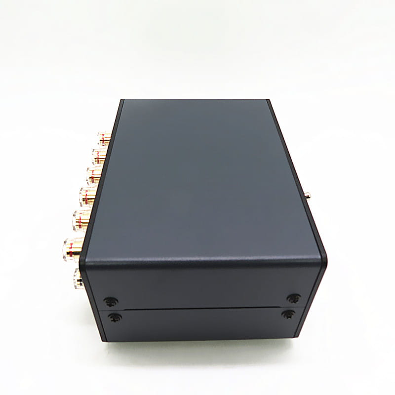 Black rectangular hifi audio switcher 2 way speaker selector box showing the back side with multiple gold-plated rca input jacks.