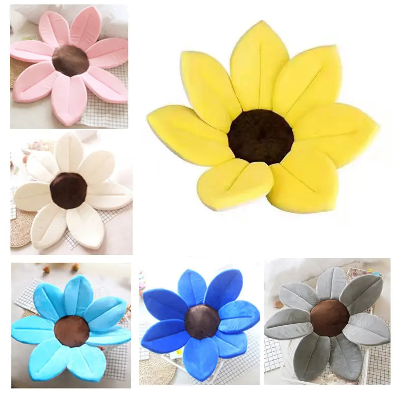 Foldable newborn bath mat and cushion shaped like a yellow sunflower with plush petals and a dark brown center designed for infant comfort and support.