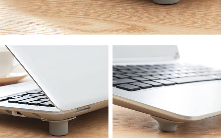 un ordinateur portable blanc avec un clavier noir reposant sur une surface en bois, à côté d’un ensemble de quatre patins de réduction de la chaleur pour pieds de refroidissement d’ordinateur portable.