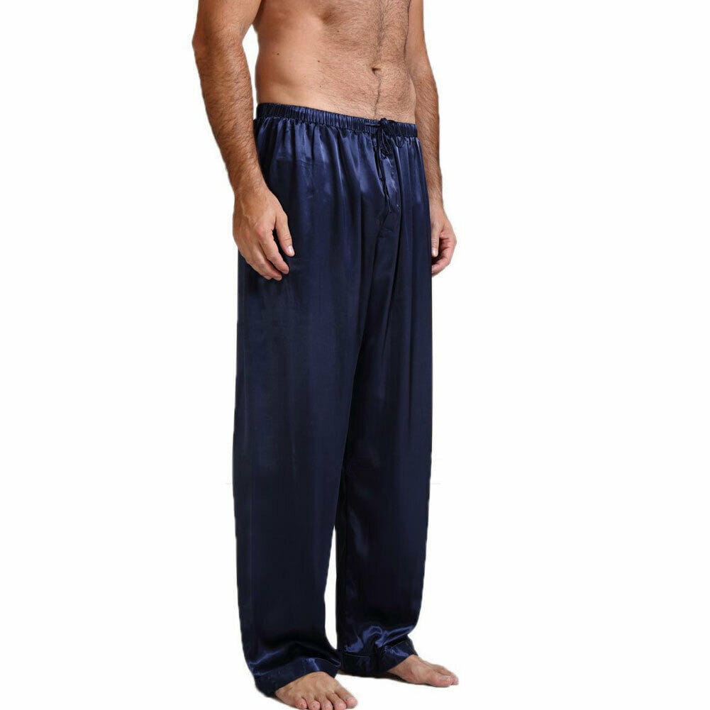 pantalons de pyjama en satin de soie pour homme en bleu marine, avec taille élastique et cordon de serrage, conçus comme des bas de nuit amples.