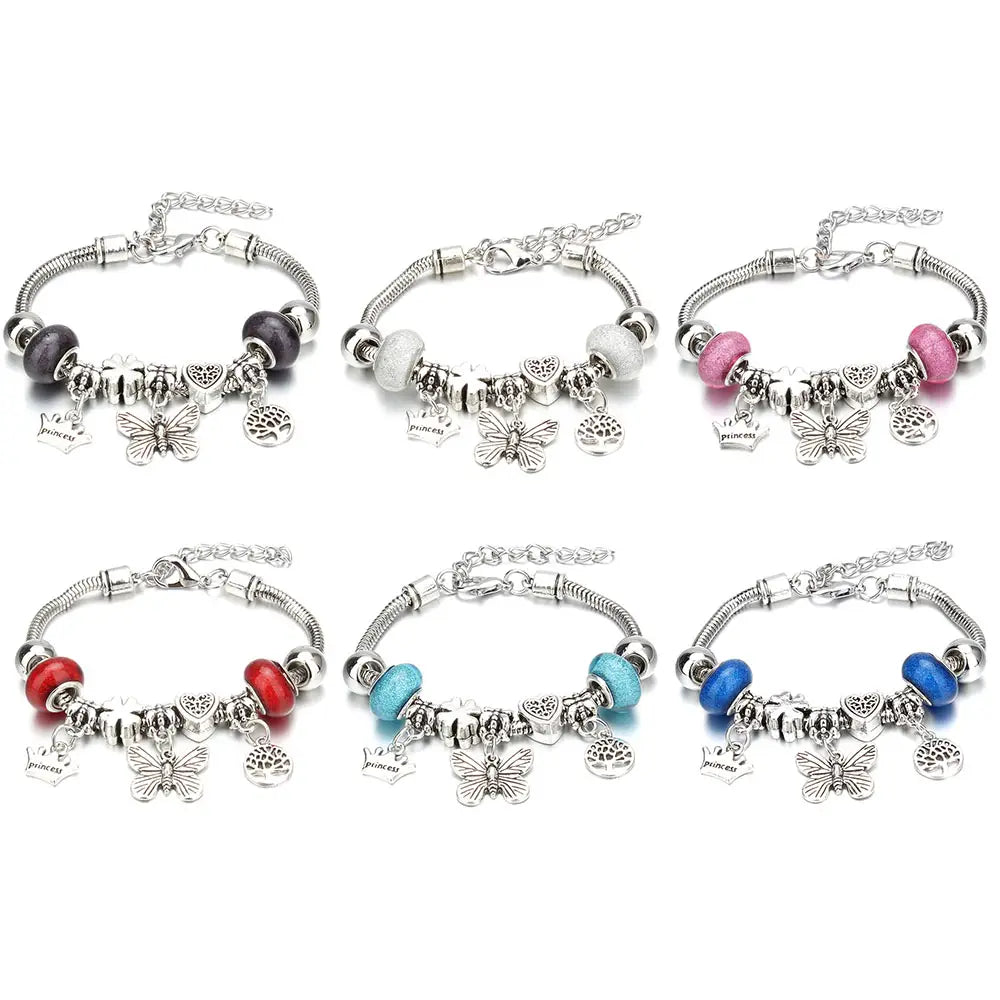 six silver-toned beaded charm bracelets featuring snake chain designs with colorful beads and dangling butterfly charms for women