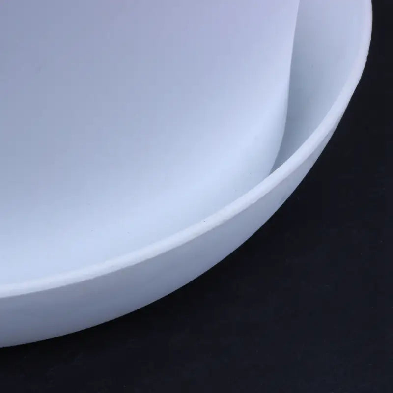 a sleek matte white ceramic bowl with smooth rounded edges and minimalist design shown as a white plastic plant pot with saucer 17cm suitable for wholesale drop shipping order