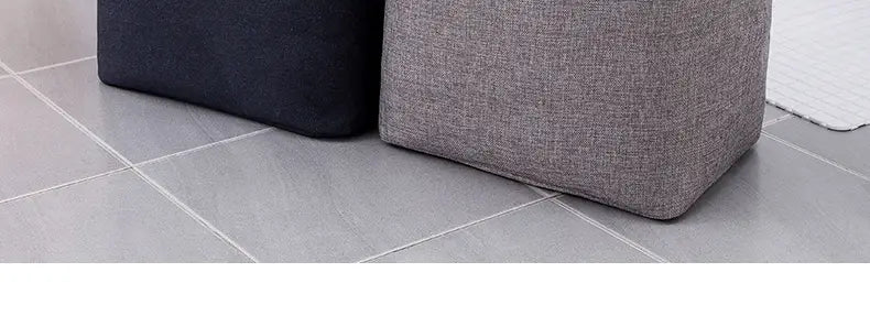 gray textured fabric ottoman designed as a foldable laundry basket and storage basket for versatile fabric storage solutions