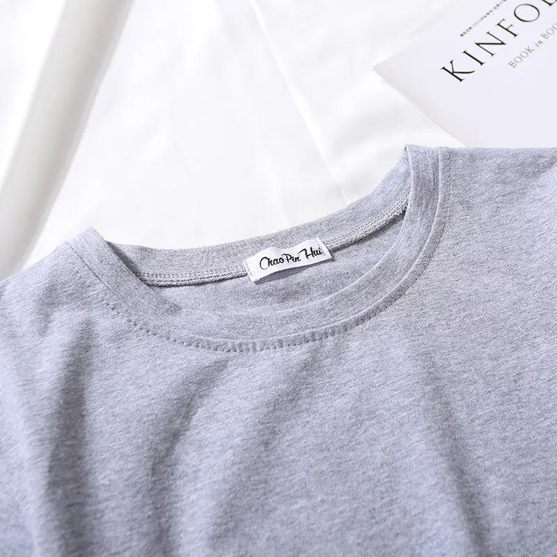 Women solid short sleeve crop top casual t-shirt in gray heathered cotton with a simple round neckline and a white chao pan hui brand tag at the collar.