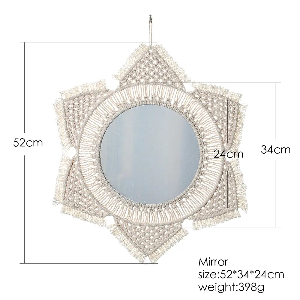 A cream-colored boho macrame wall mirror with a circular reflective center and intricate woven patterns finished with flowing fringe for living room home decor.