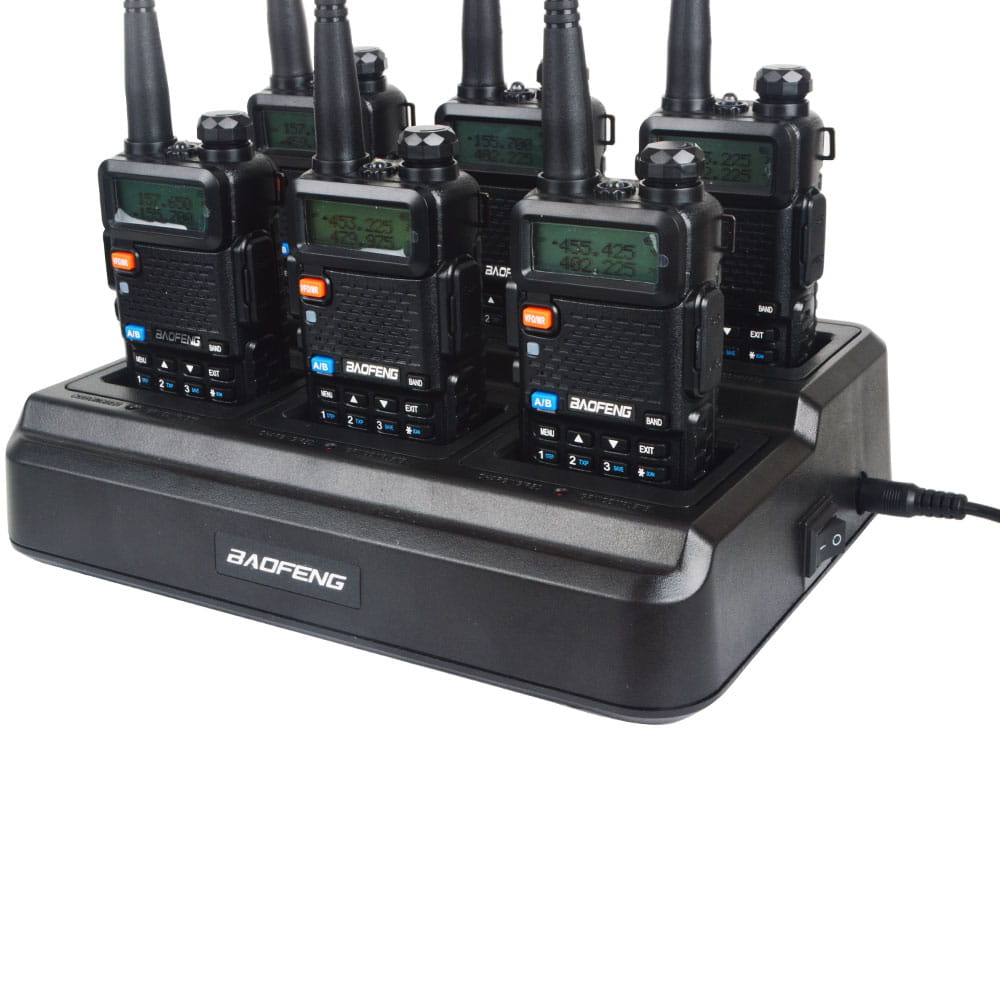 black baofeng bf-888s walkie talkies neatly arranged in a black bl-5x6 six way rapid charger base compatible with uv-5r models.