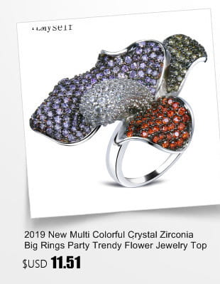 A silver-toned black and white crystal statement flower ring featuring a large multi-colored crystal zirconia flower design with purple green and orange hues.