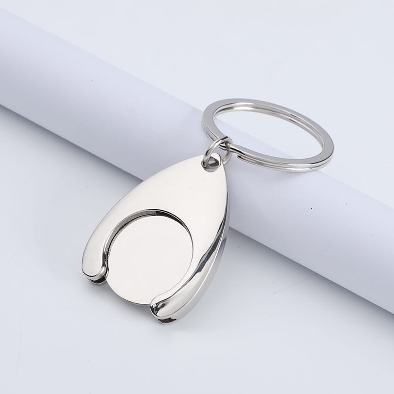 Custom engraved metal keychain in silver metallic featuring a sleek teardrop-shaped design with an integrated circular cutout.