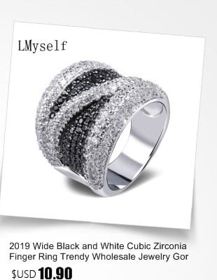 A wide elegant black and white crystal statement flower ring featuring alternating bands of black and white cubic zirconia set in sleek silver-toned metal.