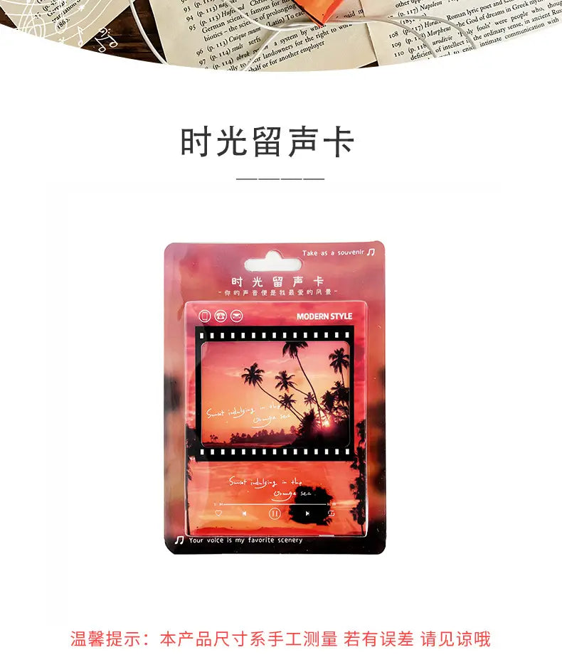 Carte de vœux musicale au style cassette ruban de film vintage, présentant un design de carte mémoire rose et noir avec un coucher de soleil et une silhouette de palmiers.