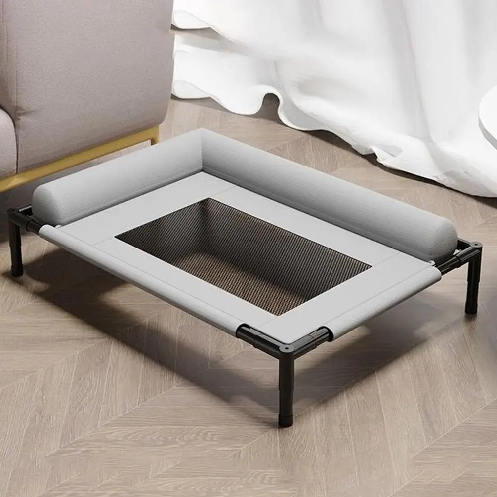 Gray elevated dog bed with breathable mesh center and padded edges supported by black metal legs for raised pet comfort