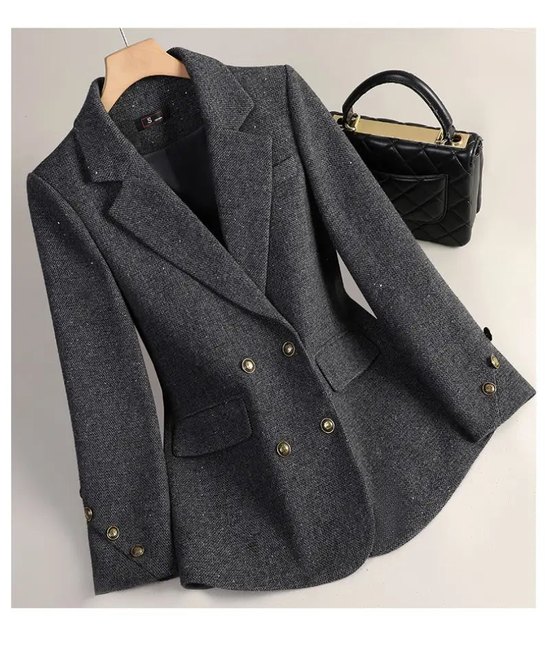 Dark gray wool blend double breasted blazer with textured fabric and gold toned buttons.