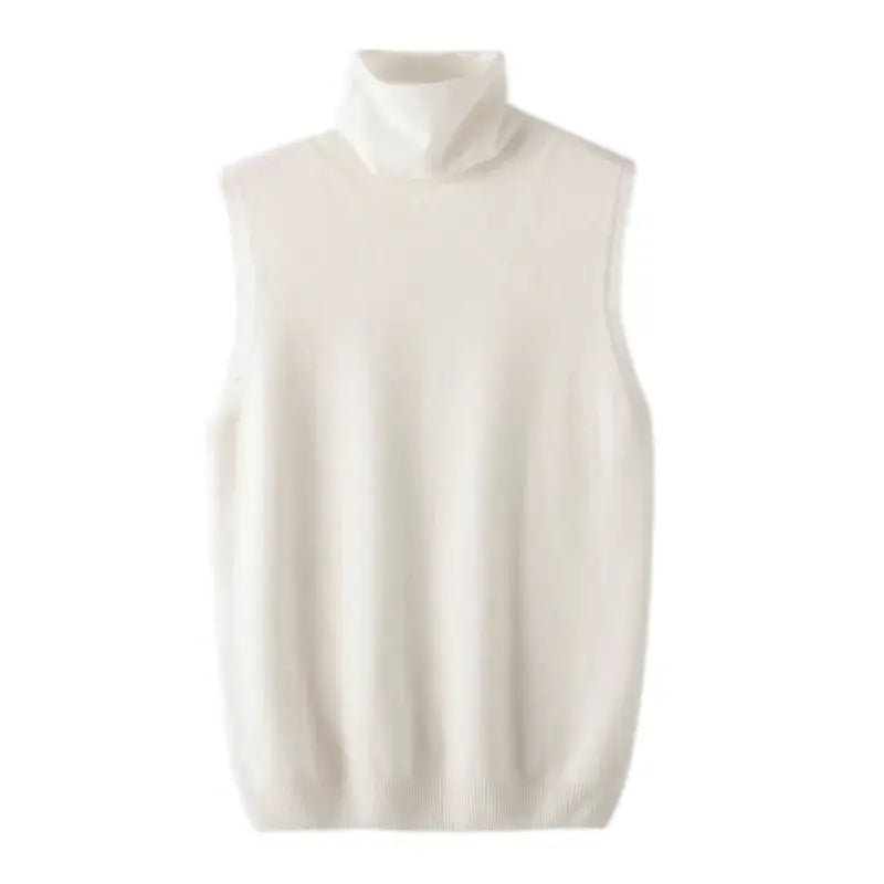 Cream-colored sleeveless merino wool turtleneck vest for women with a soft ribbed knit texture designed as a slim base layer.