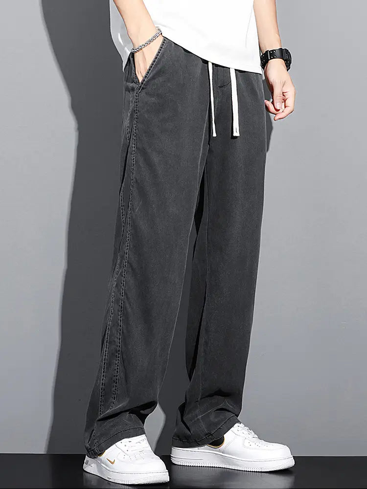 Men’s lyocell casual loose straight black wide-leg pants with white drawstring and visible stitching along the side seams