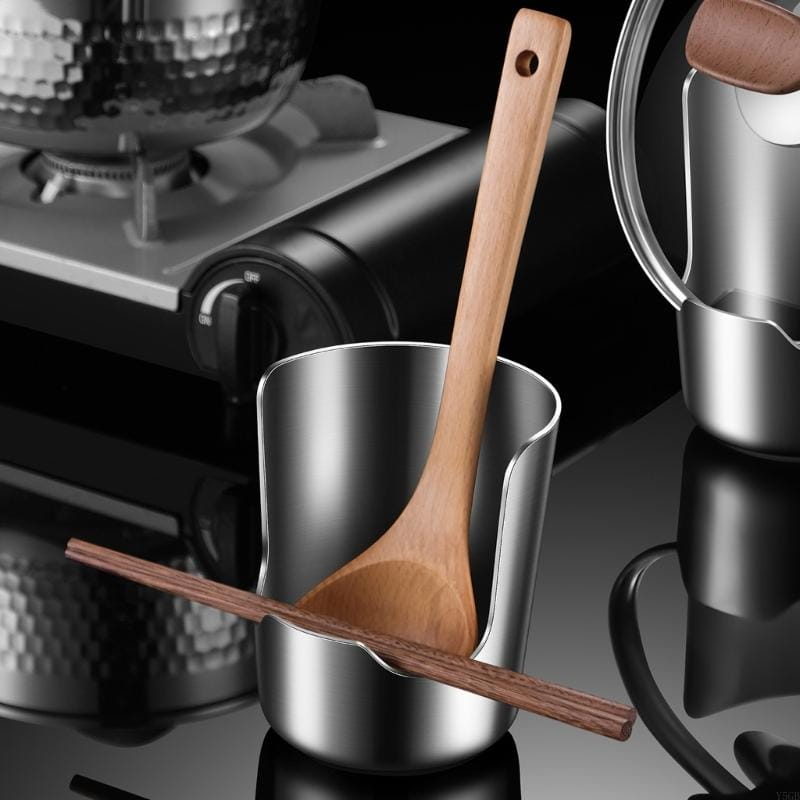 A sleek stainless steel pot lid and spoon holder stand with a wooden spoon and chopsticks inside.