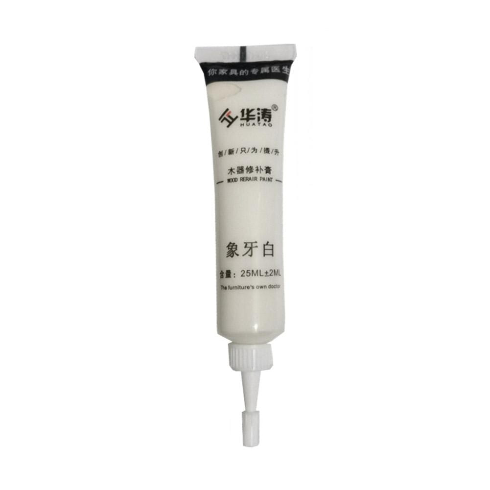 White tube of Huatao brand wood repair paste touch-up paint in elephant ivory color with nozzle tip for complementary paint in scratch repair paste and touch-up paint kit.