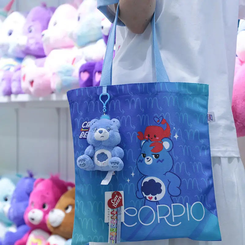 Blue care bears plush bag pendant keychain toy featuring a scorpion-themed tote bag design with plush bear charms and zodiac symbols.