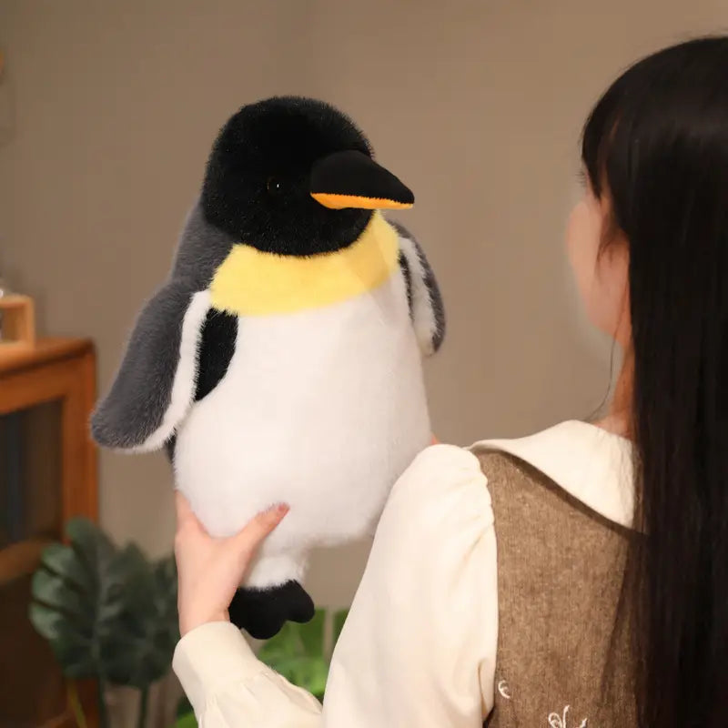 A plush penguin stuffed animal soft toy pair featuring a black head, yellow chest band, white belly, and gray wings made from soft material.
